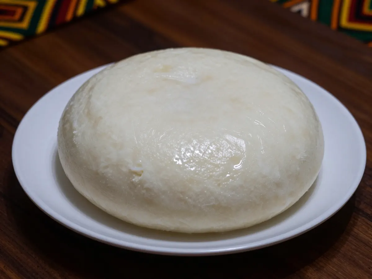 AI-generated photograph: A smooth white mound of pounded yam